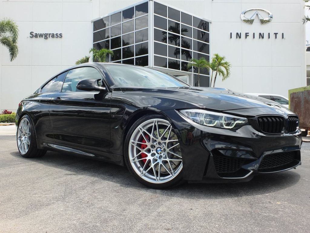 2018 BMW M4 Base Competition FULL LEATHER & CARBON PKG in Black Sapphire Metallic — front three-quarter view