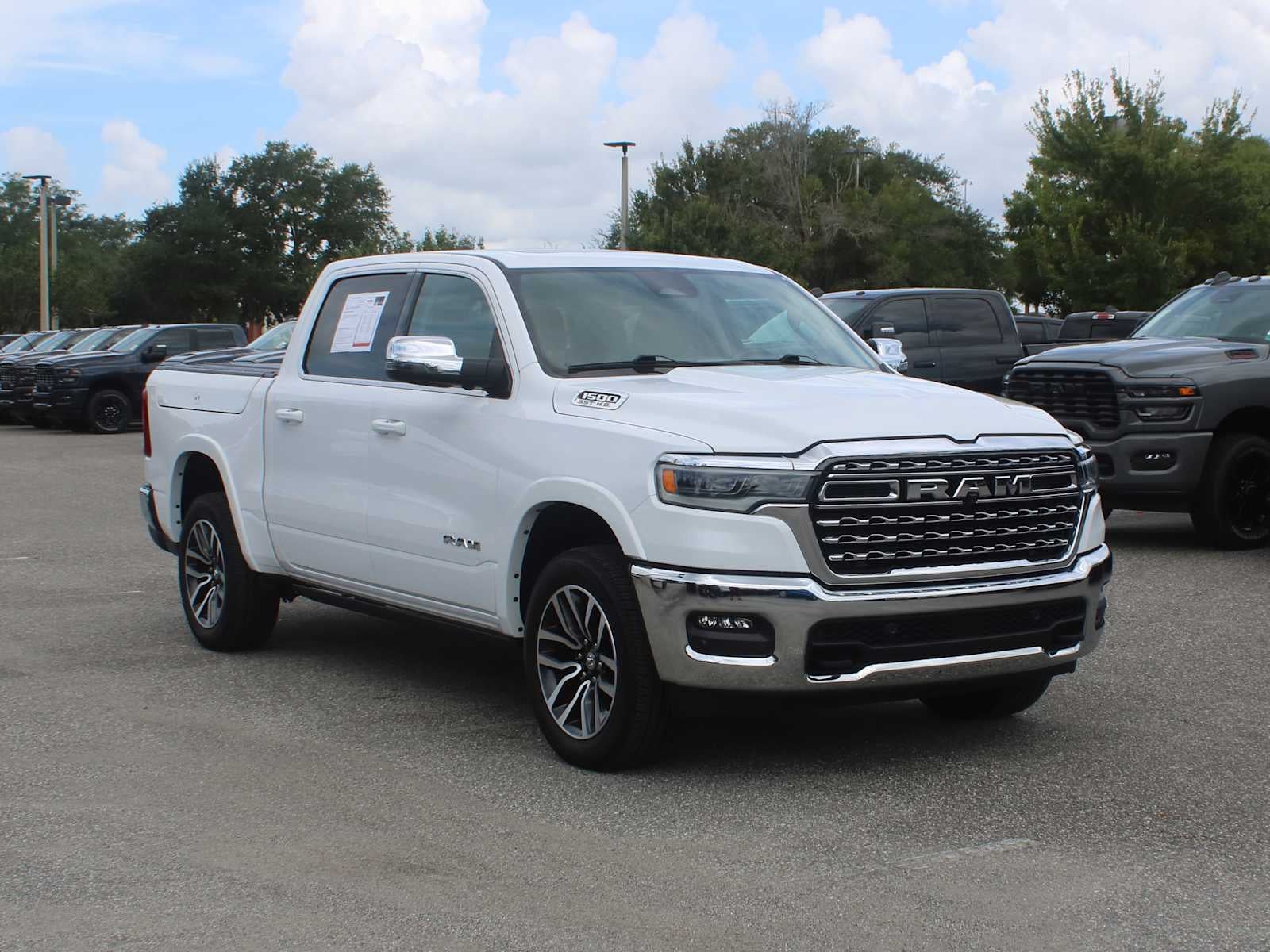 2025 RAM 1500 Longhorn in Bright White Clearcoat — front three-quarter view