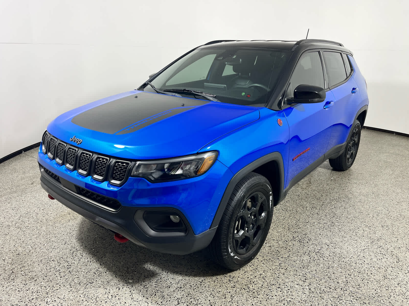 2023 Jeep Compass Trailhawk in Laser Blue Pearlcoat — front three-quarter view