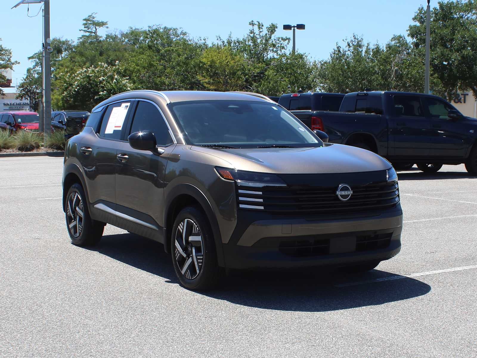 2026 Nissan Kicks SV in Canyon Bronze Metallic — front three-quarter view