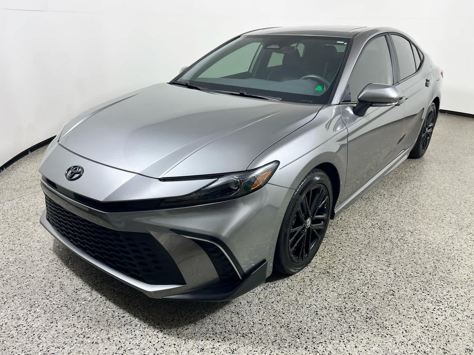 2025 Toyota Camry SE in Heavy Metal — front three-quarter view