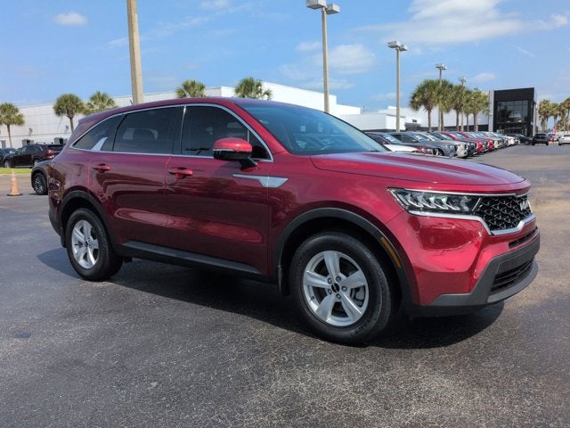 2022 Kia Sorento LX in Passion Red Tintcoat — front three-quarter view