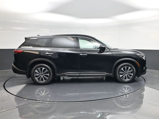 2025 INFINITI QX60 PURE in Mineral — front three-quarter view