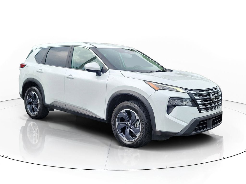 2024 Nissan Rogue SV in White Pearl — front three-quarter view