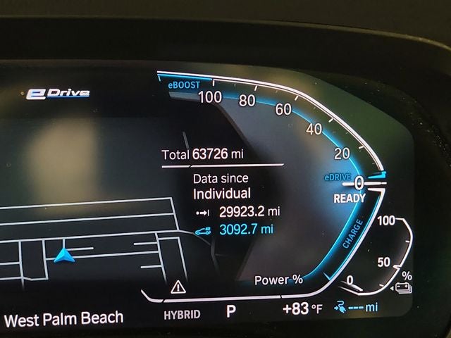2022 BMW X5 xDrive45e in White Metallic — front three-quarter view