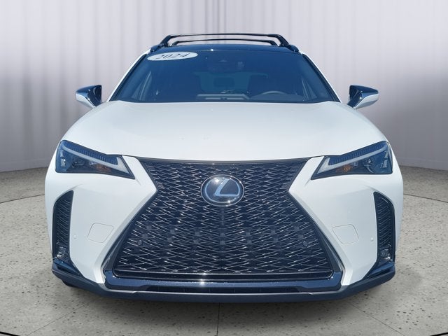 2024 Lexus UX 250h F SPORT Handling in White — front three-quarter view