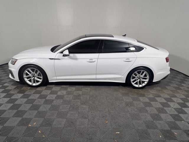 2024 Audi A5 Sportback S line Premium Plus in Arkona White — front three-quarter view