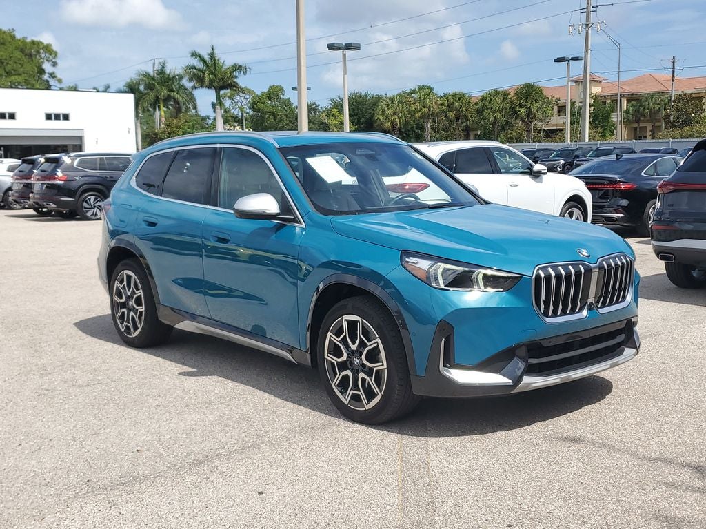 2024 BMW X1 xDrive28i in Blue Bay Lagoon Metallic — front three-quarter view