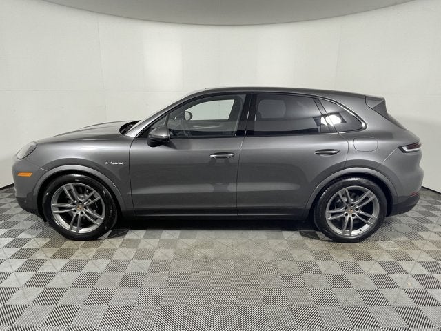 2025 Porsche Cayenne E-Hybrid in Quartzite Grey Metallic — front three-quarter view