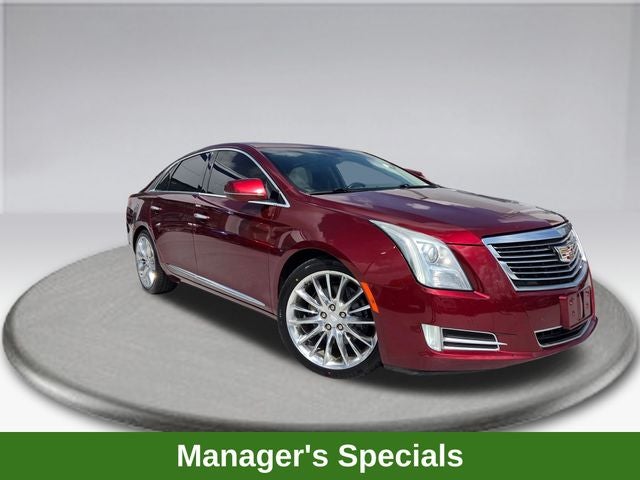 2016 Cadillac XTS Platinum in Red Passion Tintcoat — front three-quarter view