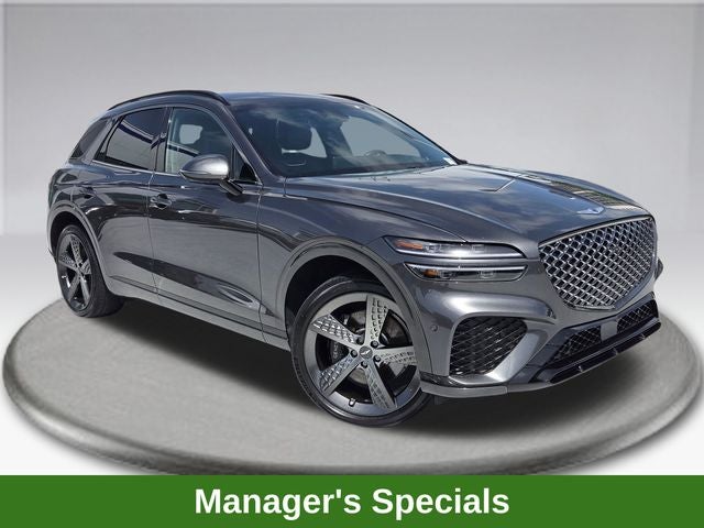 2024 Genesis GV70 2.5T in Makalu Gray — front three-quarter view