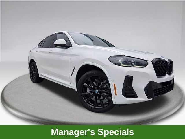 2023 BMW X4 xDrive30i in Alpine White — front three-quarter view