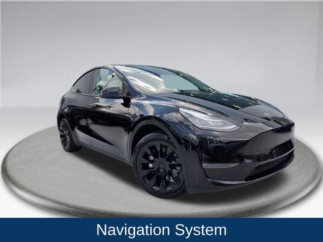 2023 Tesla Model Y Long Range in Solid Black — front three-quarter view