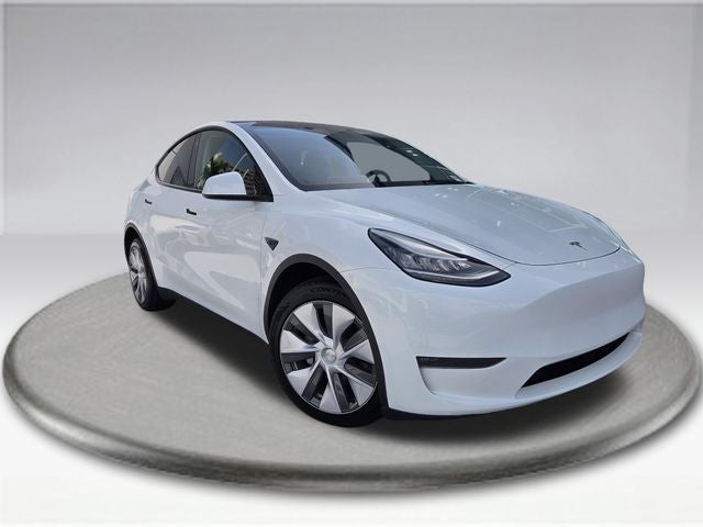 2023 Tesla Model Y Long Range in White — front three-quarter view