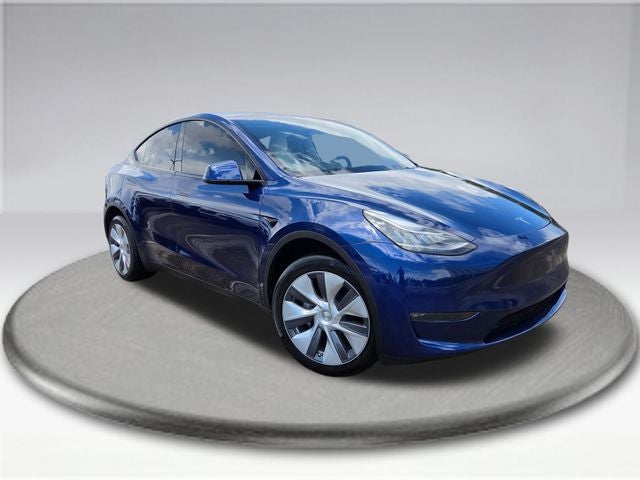 2023 Tesla Model Y Long Range in Deep Blue Metallic — front three-quarter view