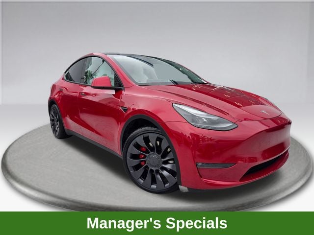 2022 Tesla Model Y Performance in Red Multi-Coat — front three-quarter view