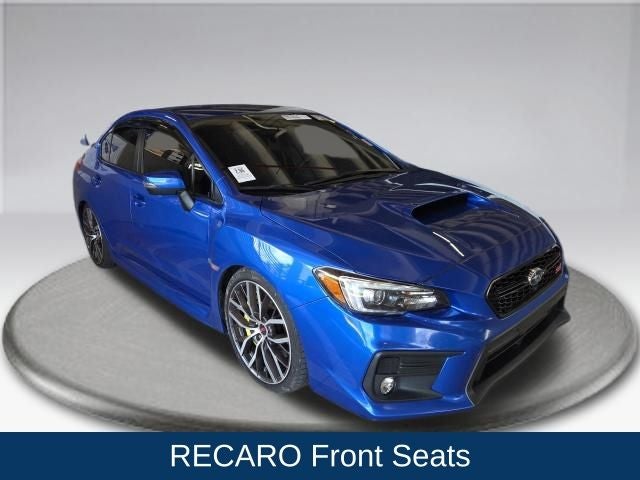 2021 Subaru WRX STi in Blue Pearl — front three-quarter view
