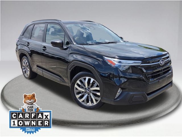 2025 Subaru Forester Touring in Crystal Black Silica — front three-quarter view