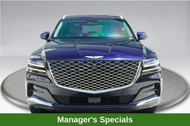 2024 Genesis GV80 3.5T in Capri Blue — front three-quarter view